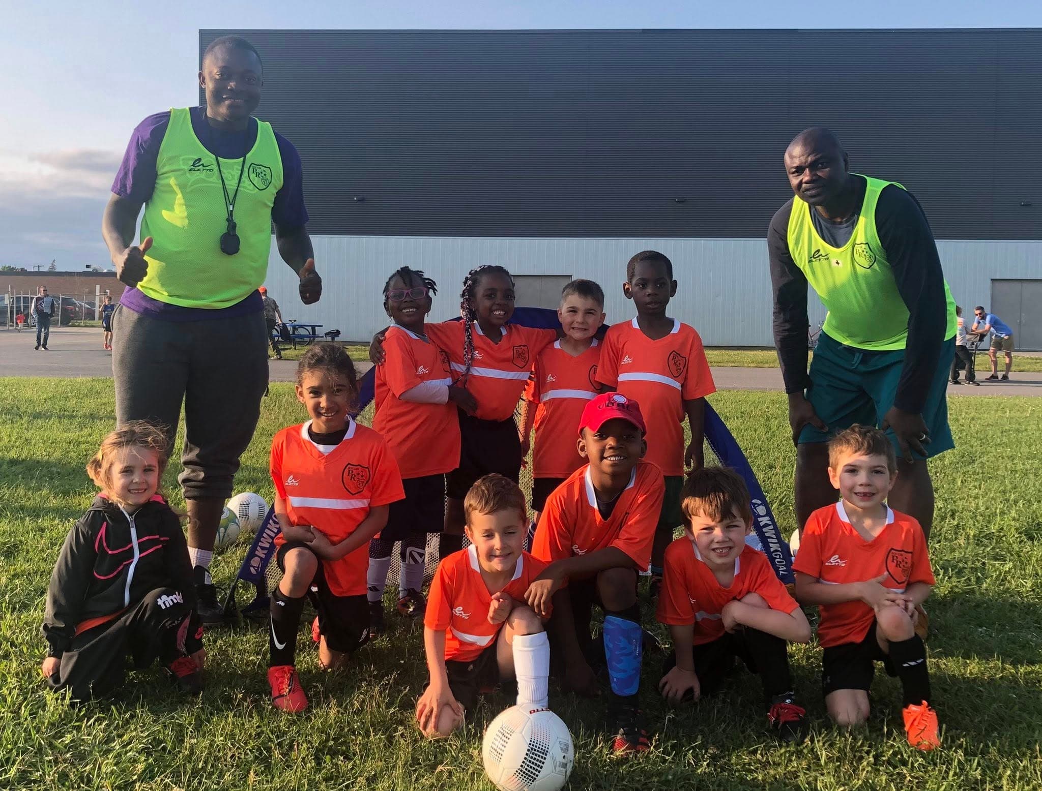 Soccer kids with coaches outdoor