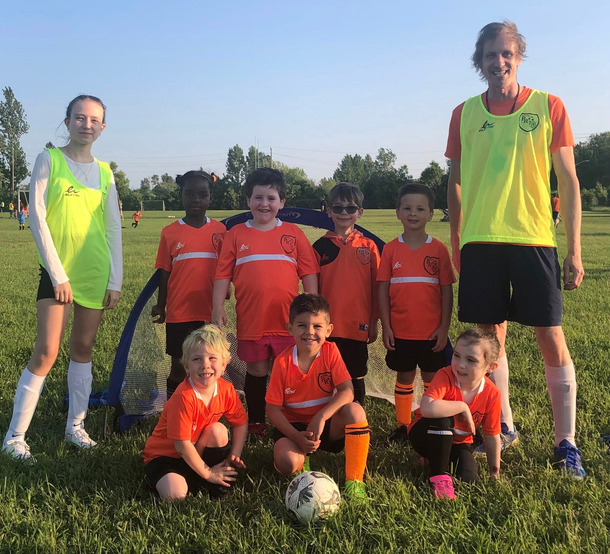 Soccer kids group with coaches