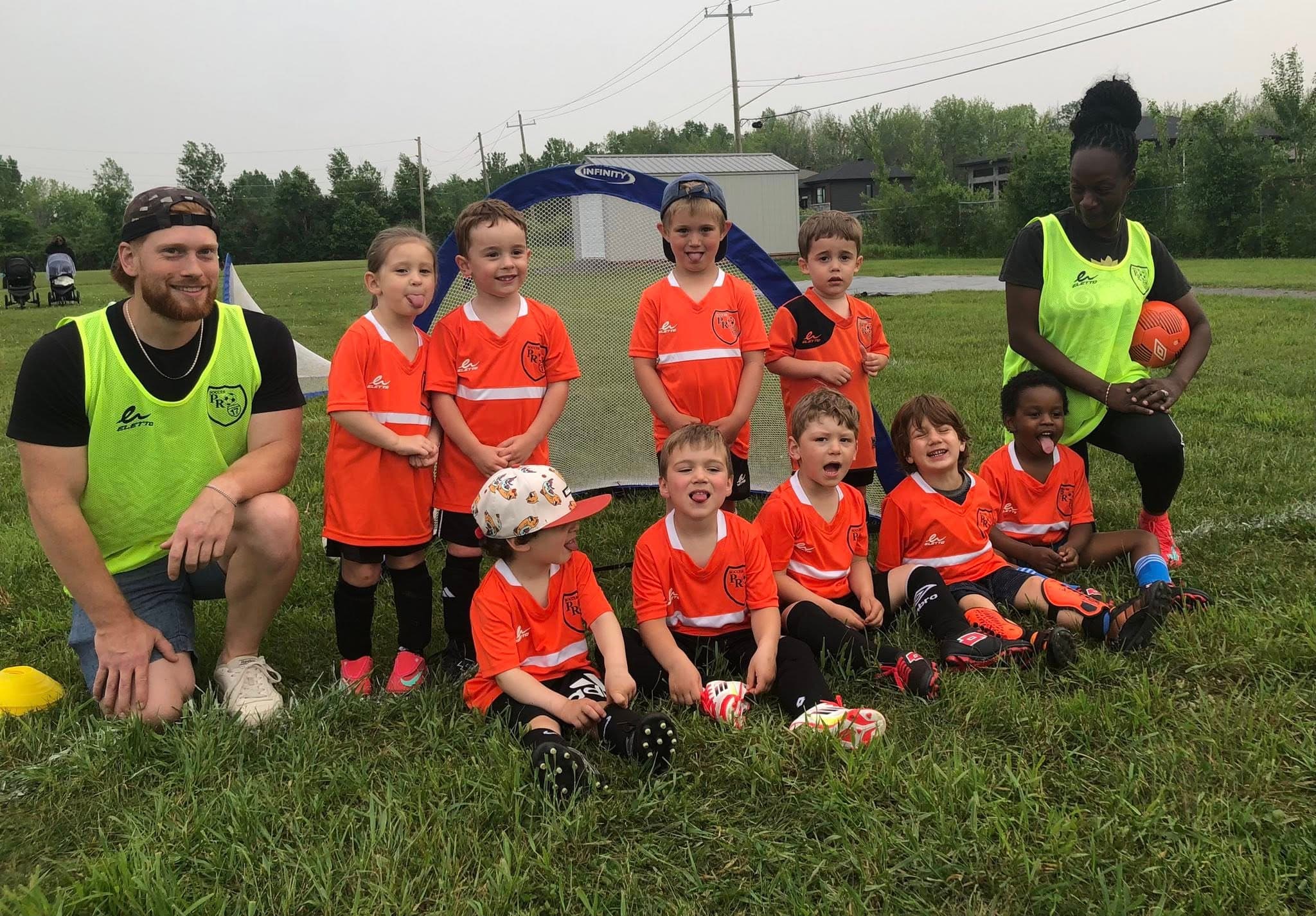 Soccer small kids team with coaches