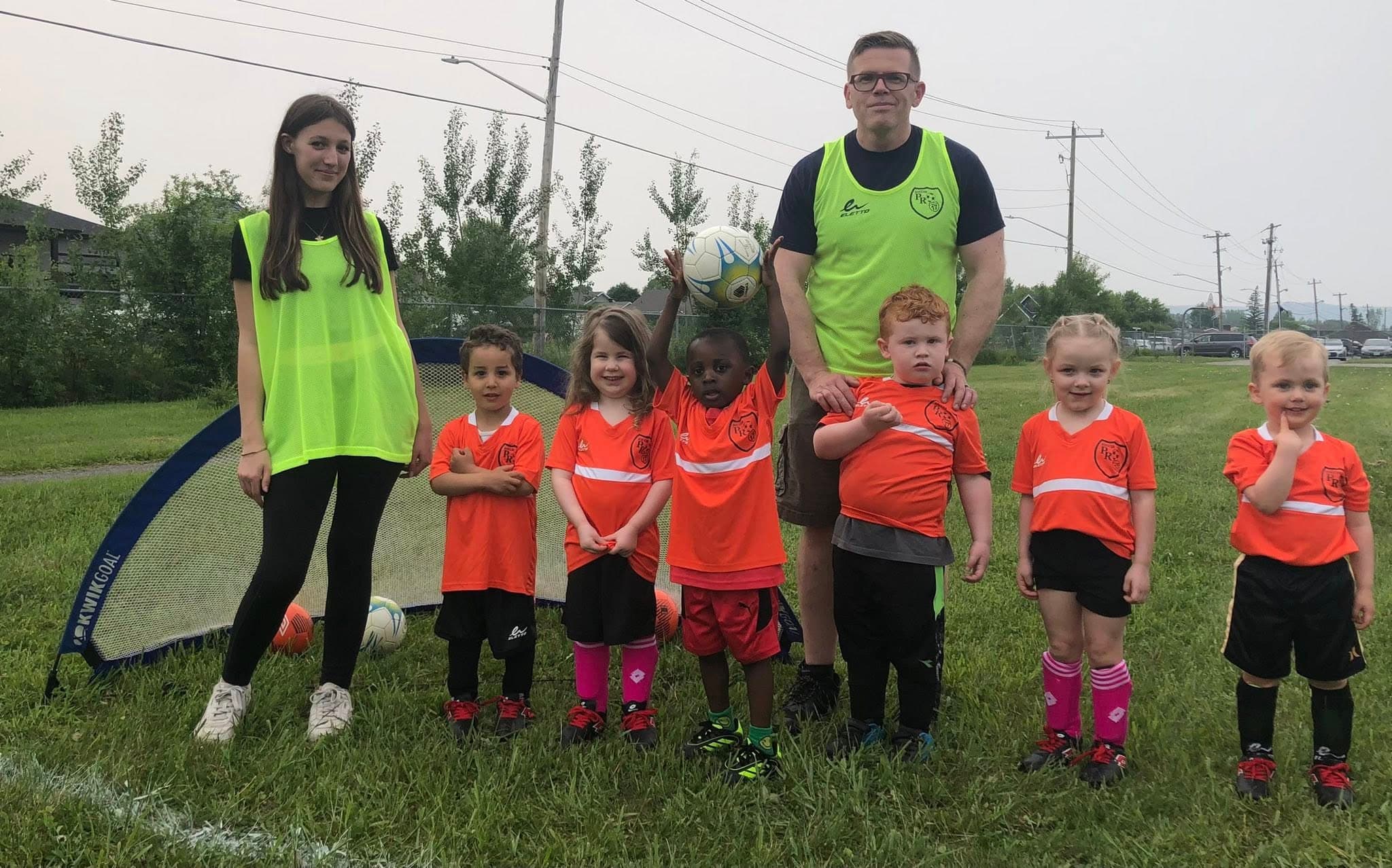Soccer toddlers team with coaches